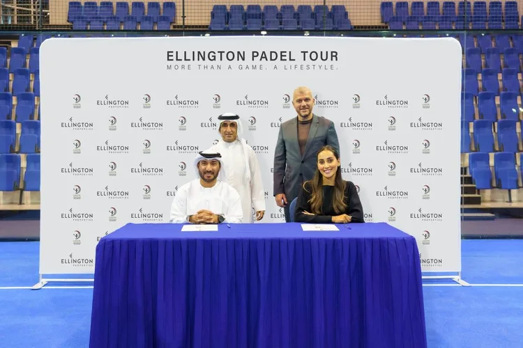 Executives from Ellington Properties and UAE Padel Association sign event sponsorship deal for Ellington Padel Tour 2026 title rights at signing ceremony with branded backdrop and padel court.
