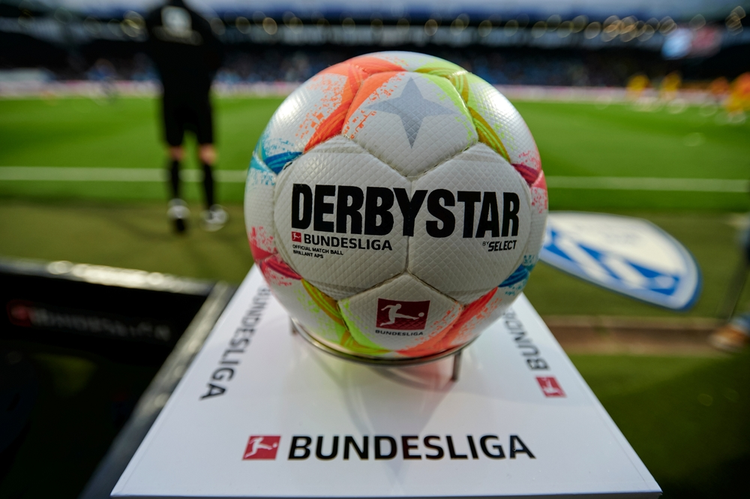 Bundesliga Derby Star match ball on pitch with league branding - iconic sports marketing and sports branding in action