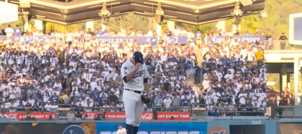 Dodgers pitcher on the mound before a packed Dodger Stadium crowd, home of Kalshi's new 435 Club sports sponsorship deal