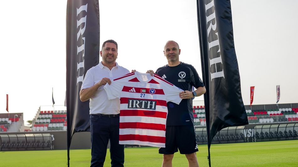 IRTH Group CEO Osman Çeliker and Gulf United head coach Andrés Iniesta marking the club's new front of shirt sports sponsorship