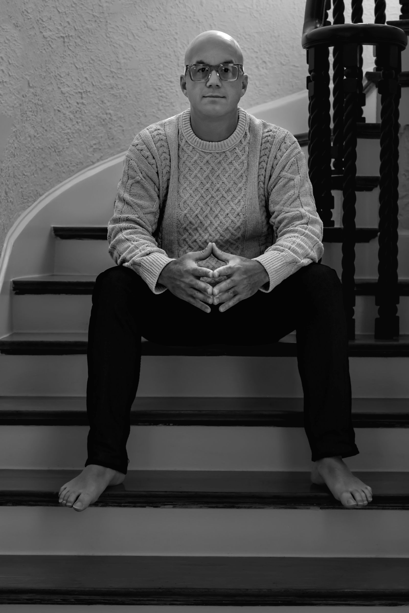 Ray Corral sitting on the stairs