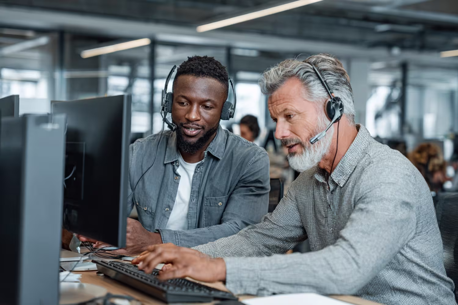IT professionals collaborating in modern office