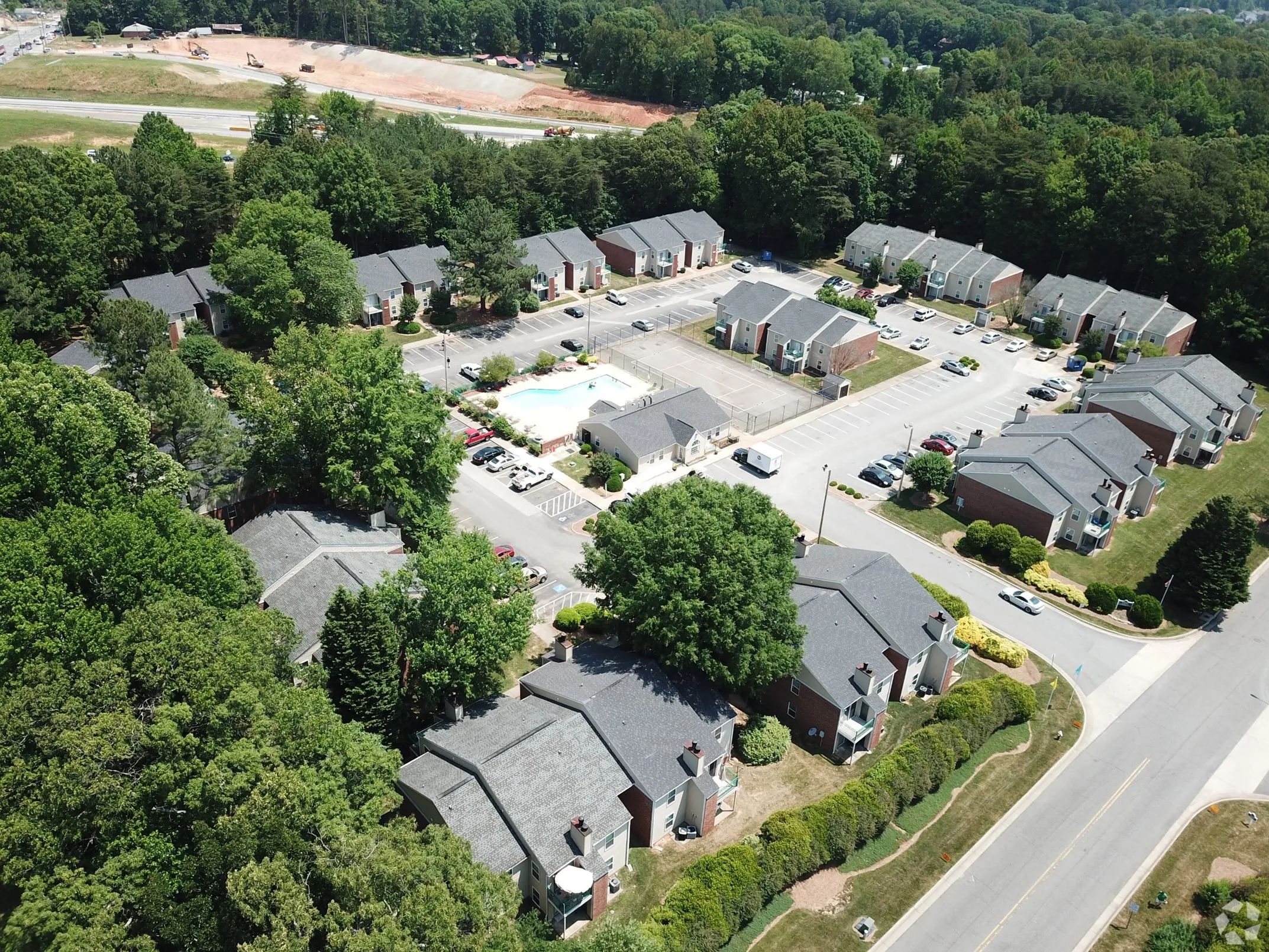 Parking lot with apartment building in the back