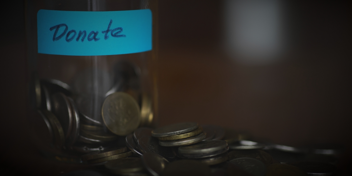 Donate cup with coins