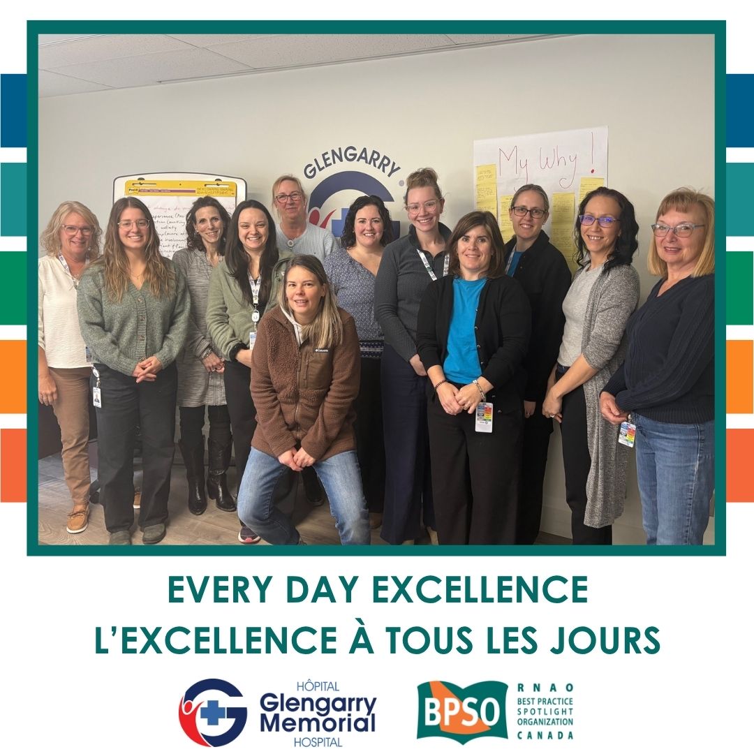 Every Day Excellence. L'excellence à tous les jours. Group of people standing in front of HGMH logo with a large paper behind that says "My why!"