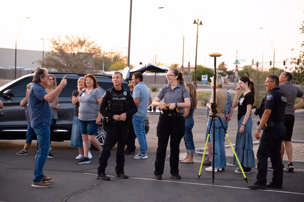 2 officers talking with group of residents