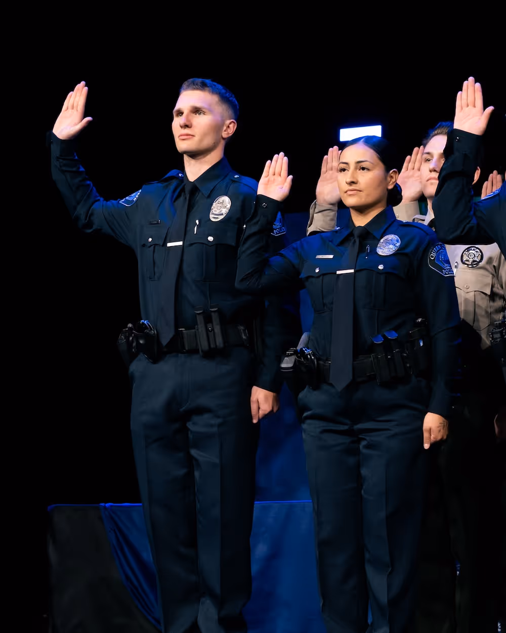 2 officers in their graduation ceremony