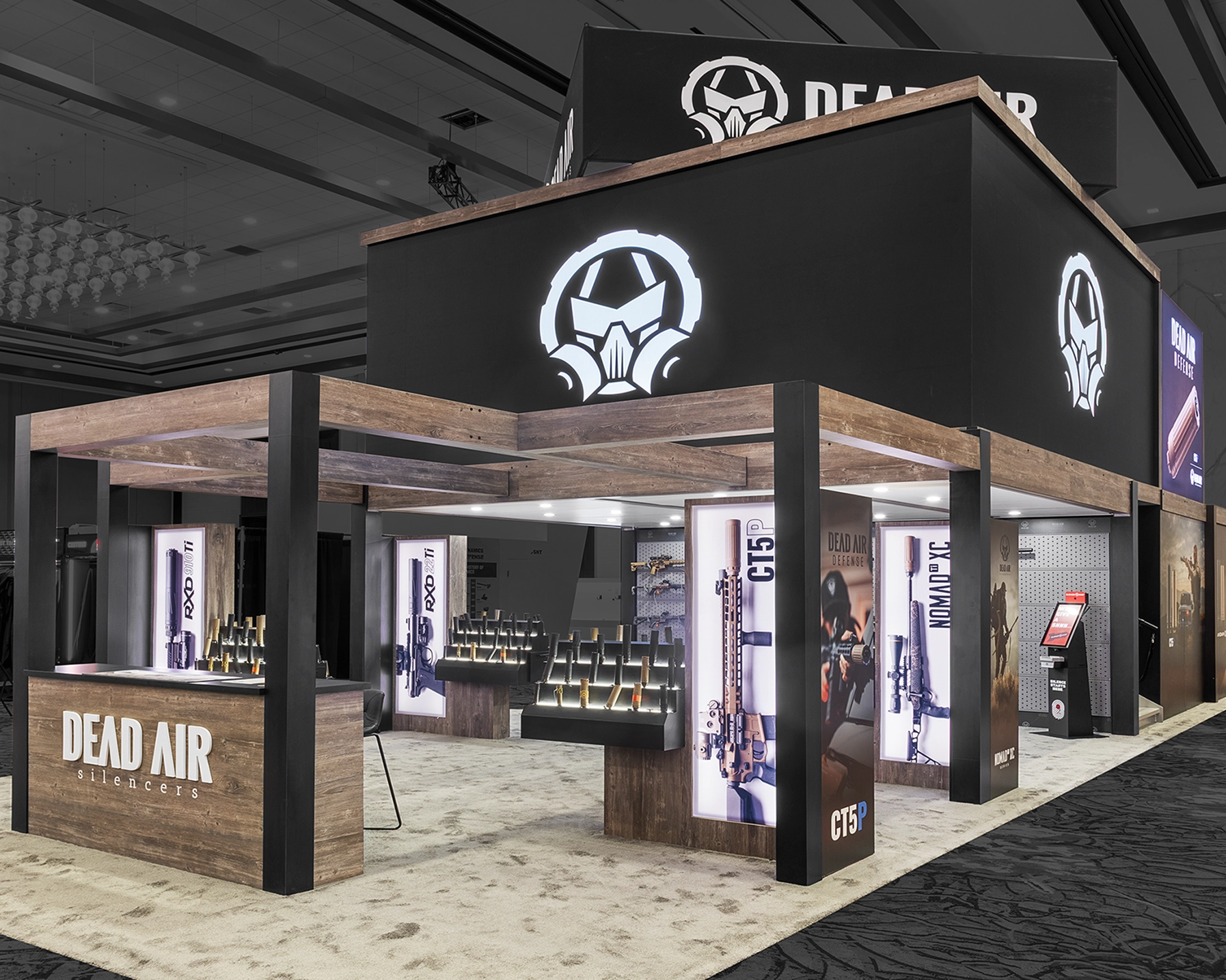 Trade show booth for Dead Air silencers displaying firearms and suppressor products with LED Screens, back-lit graphics built into mods to display silencers.