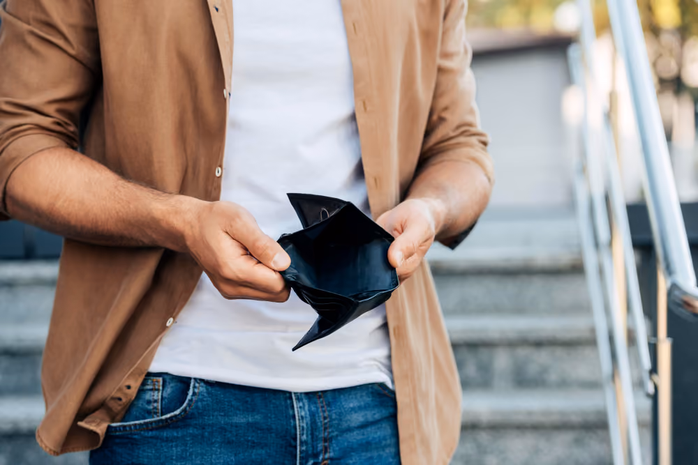 Man showing an empty wallet