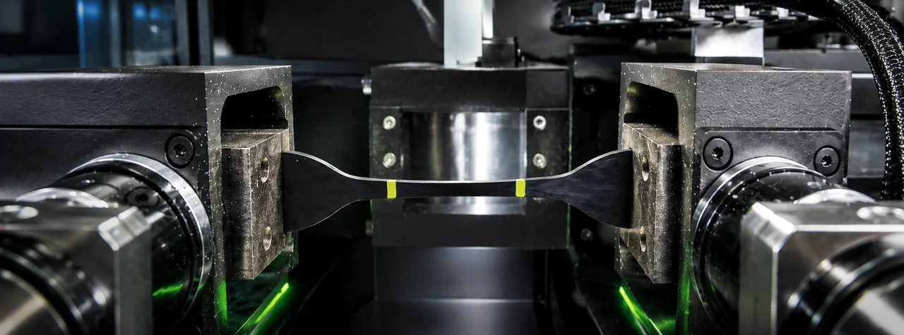 Learn how robotic material testing improves throughput, repeatability, and data traceability in plastics, rubber, and composite laboratories.