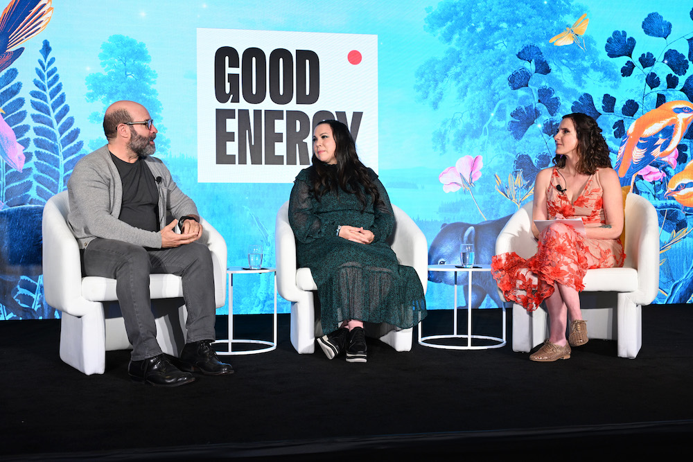 A photograph of Scott Z. Burns, Gloria Calderón Kellet, and Anna Jane Joyner at Good Energy's launch event in 2022.