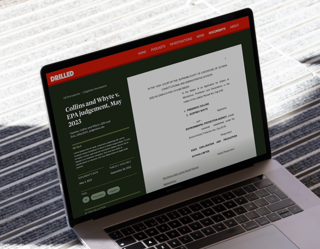 A picture of a laptop showing a document page on the Drilled website