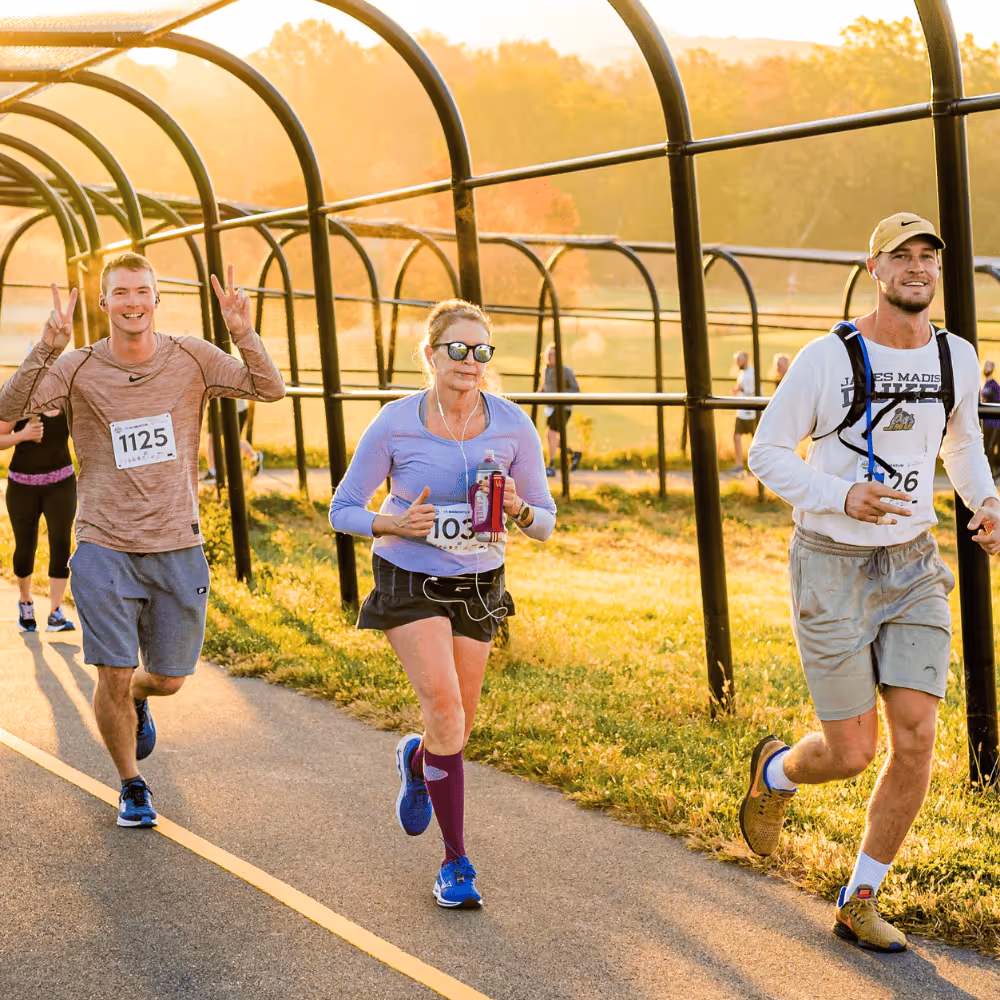 Two Pure Shenandoah founders running in the Harrisonburg half marathon, representing local community and wellness.