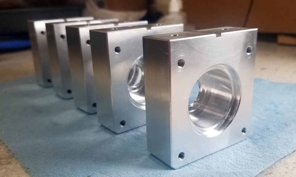 Aluminum block with large hole for bearings