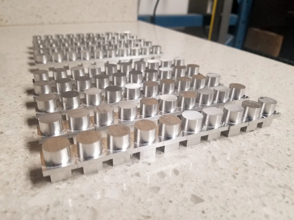 Array of small aluminum railing adapter parts