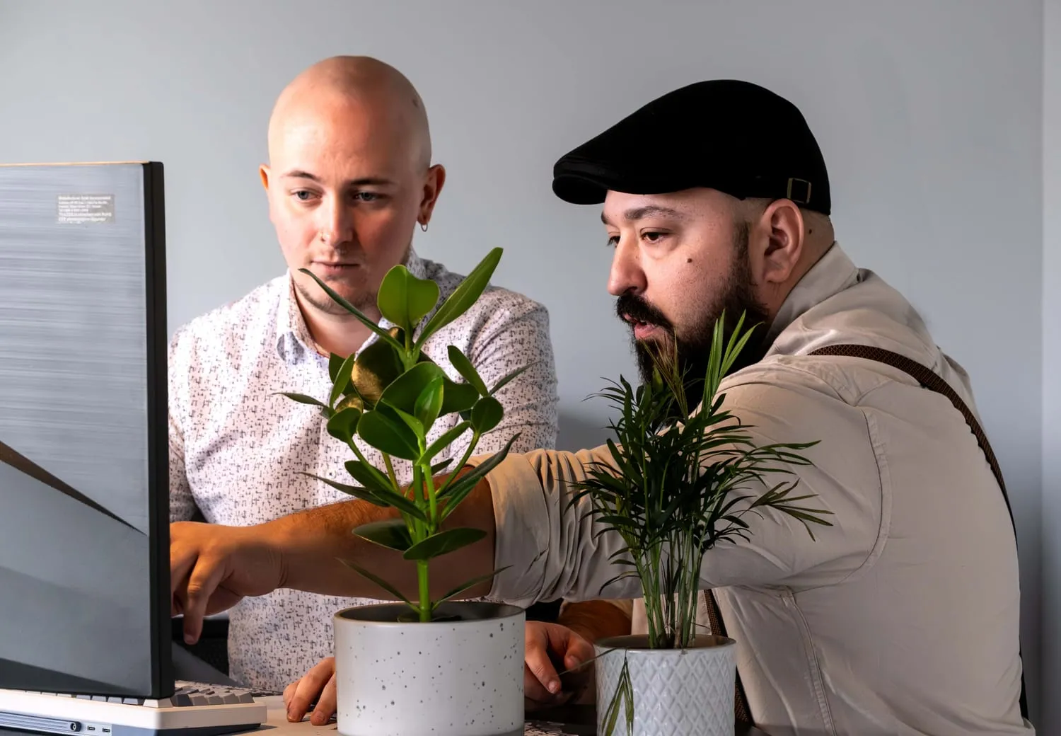 Picture of the JAK Solutions team discussing  about a project