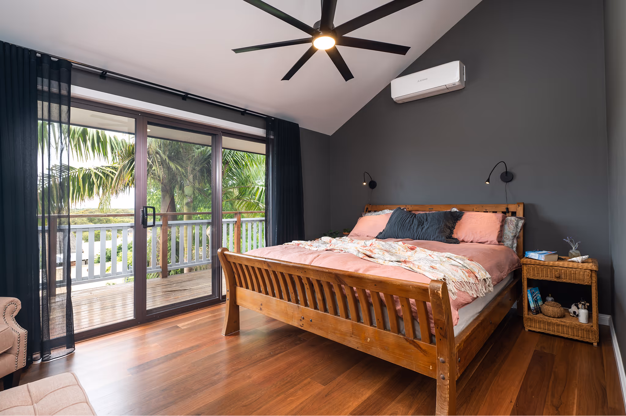 A bedroom with a bed and dark wall