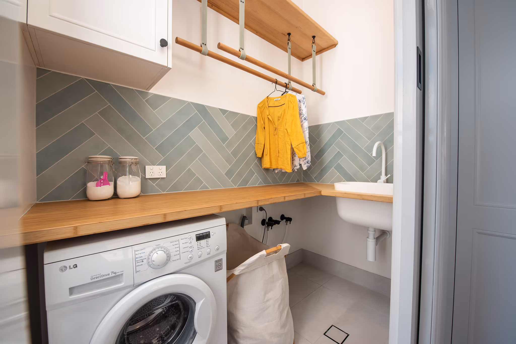 A laundry with timber finishes