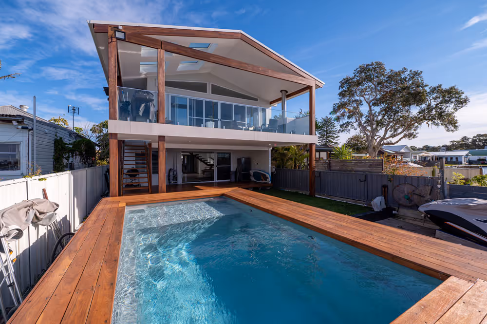 A pool outside a home