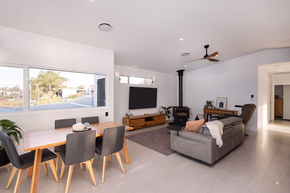 A lounge room with dining area