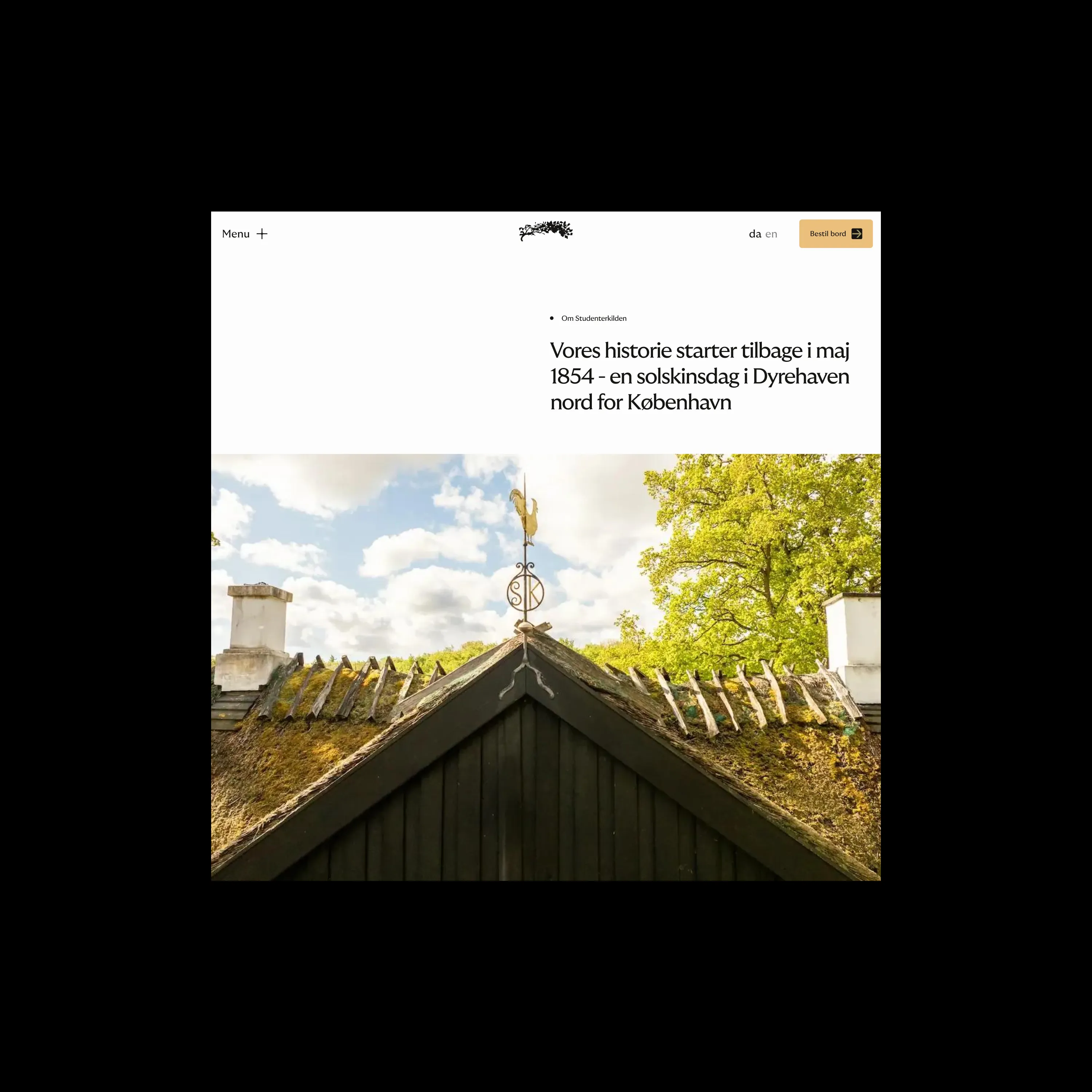 Thatched roof with golden weather vane shaped like a rooster under a partly cloudy sky and green trees.
