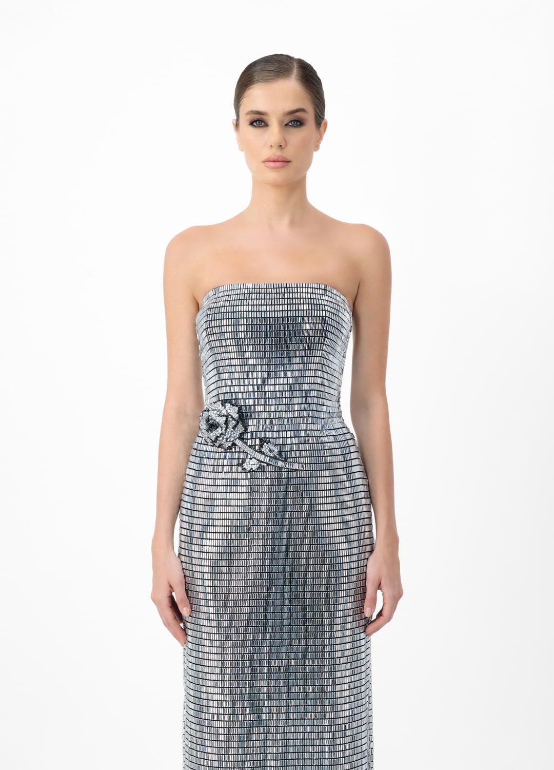 Silver dress AE2025P0015- Open-shoulder dress studded with sparkling rhinestones and a decorative rose. Zipper at back center back.