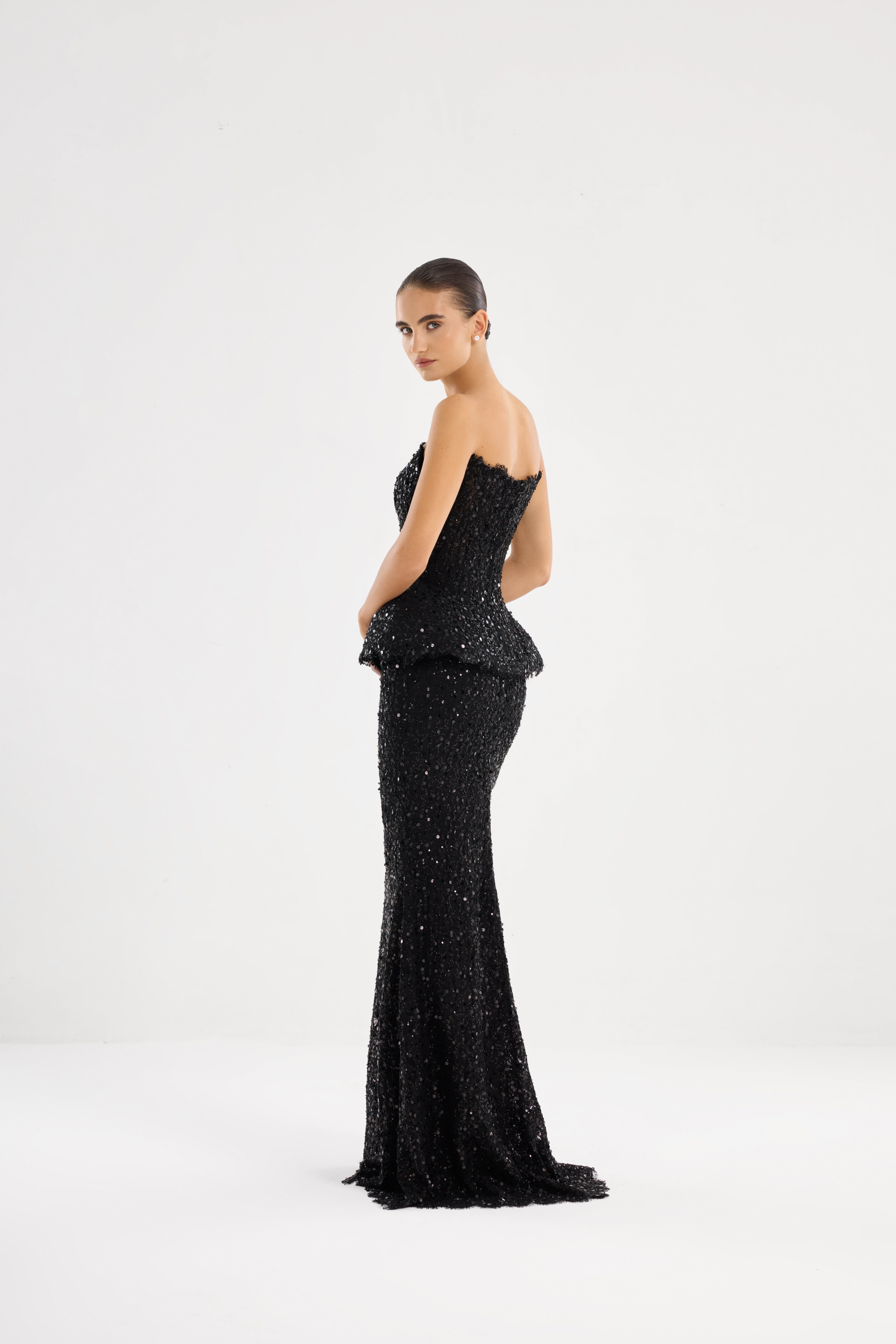 Black suit AE2026P0010 -Sequin-covered suit with an open-shoulder corset and floor-length skirt. Zipper closure at the center back - ADAMARIS - the international brand 