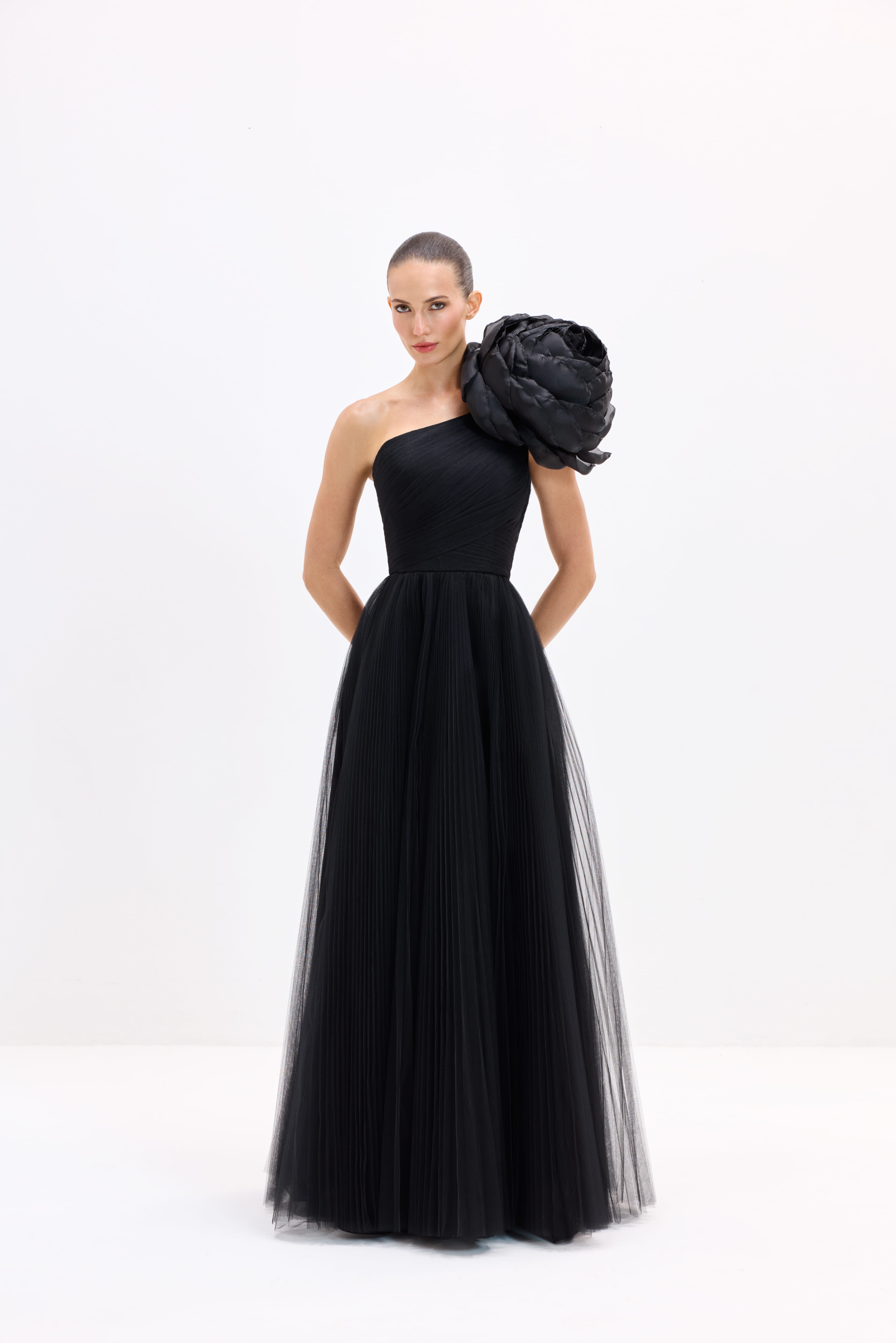 Black dress AES2026P0003- Maxi-length dress with a detachable rose. Center-back zipper closure - ADAMARIS - the international brand 