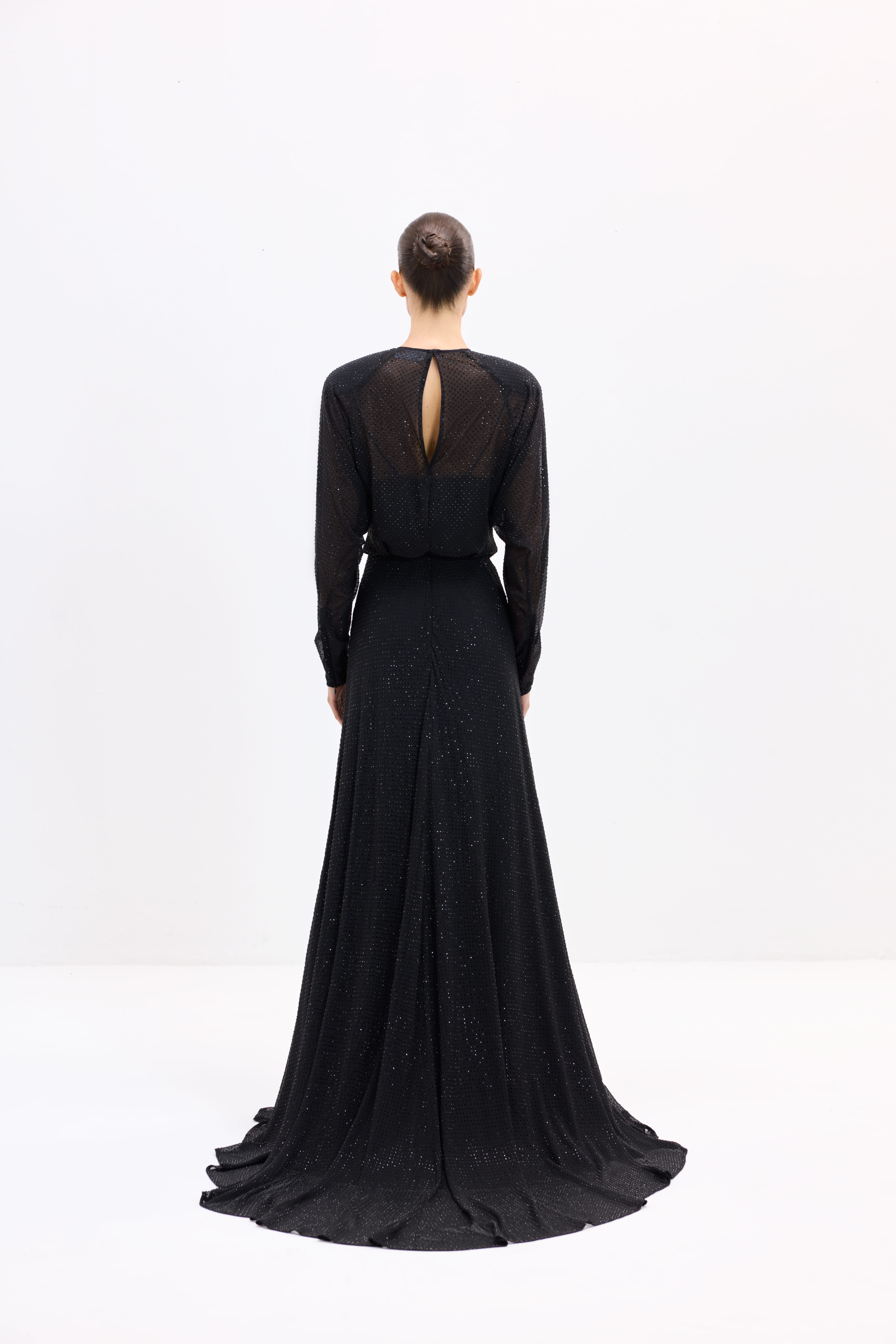 Black dress AES2026P0002- A maxi-length dress with long sleeves, embellished with rhinestones. It features a center-back zipper - ADAMARIS - the international brand 