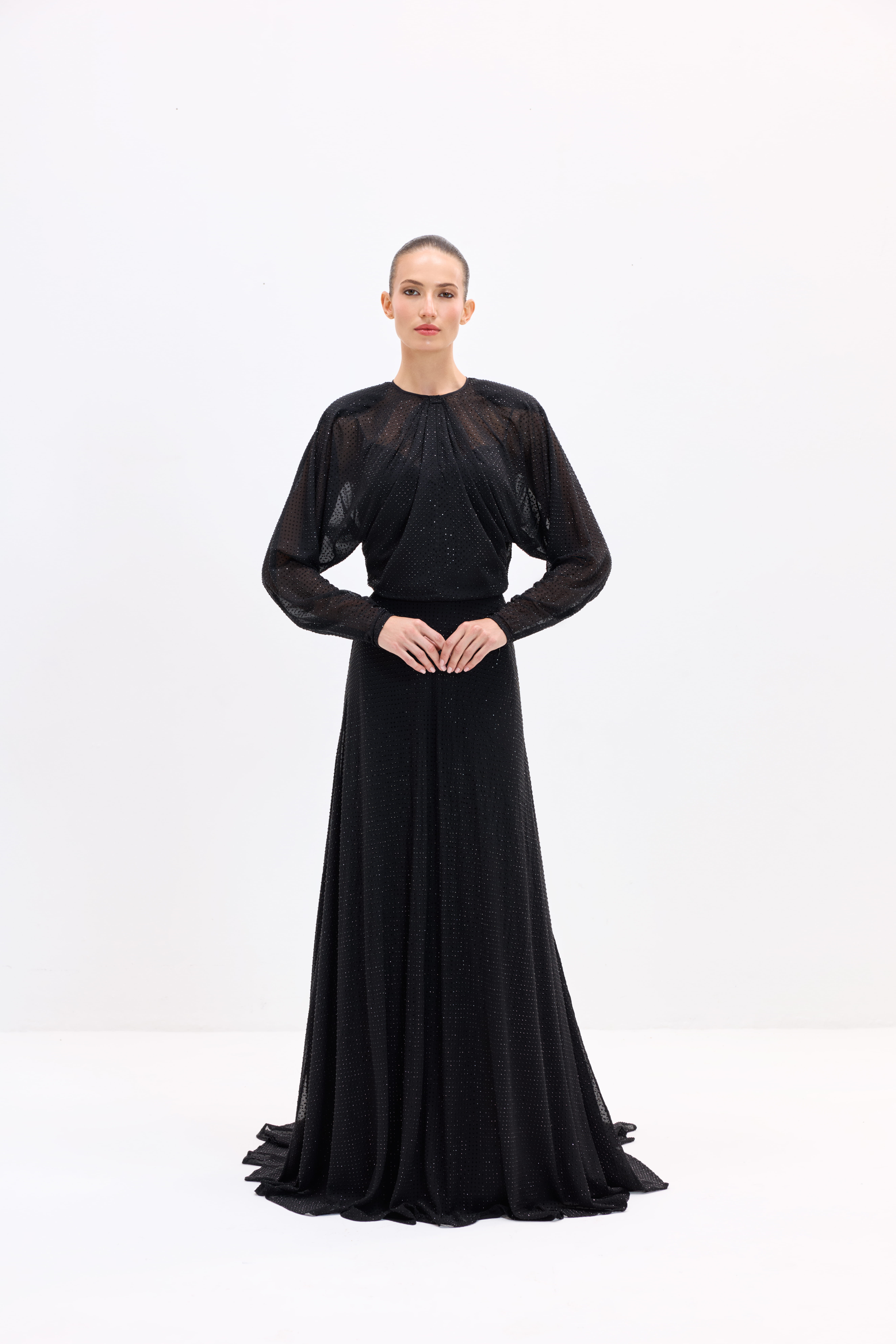 Black dress AES2026P0002- A maxi-length dress with long sleeves, embellished with rhinestones. It features a center-back zipper - ADAMARIS - the international brand 