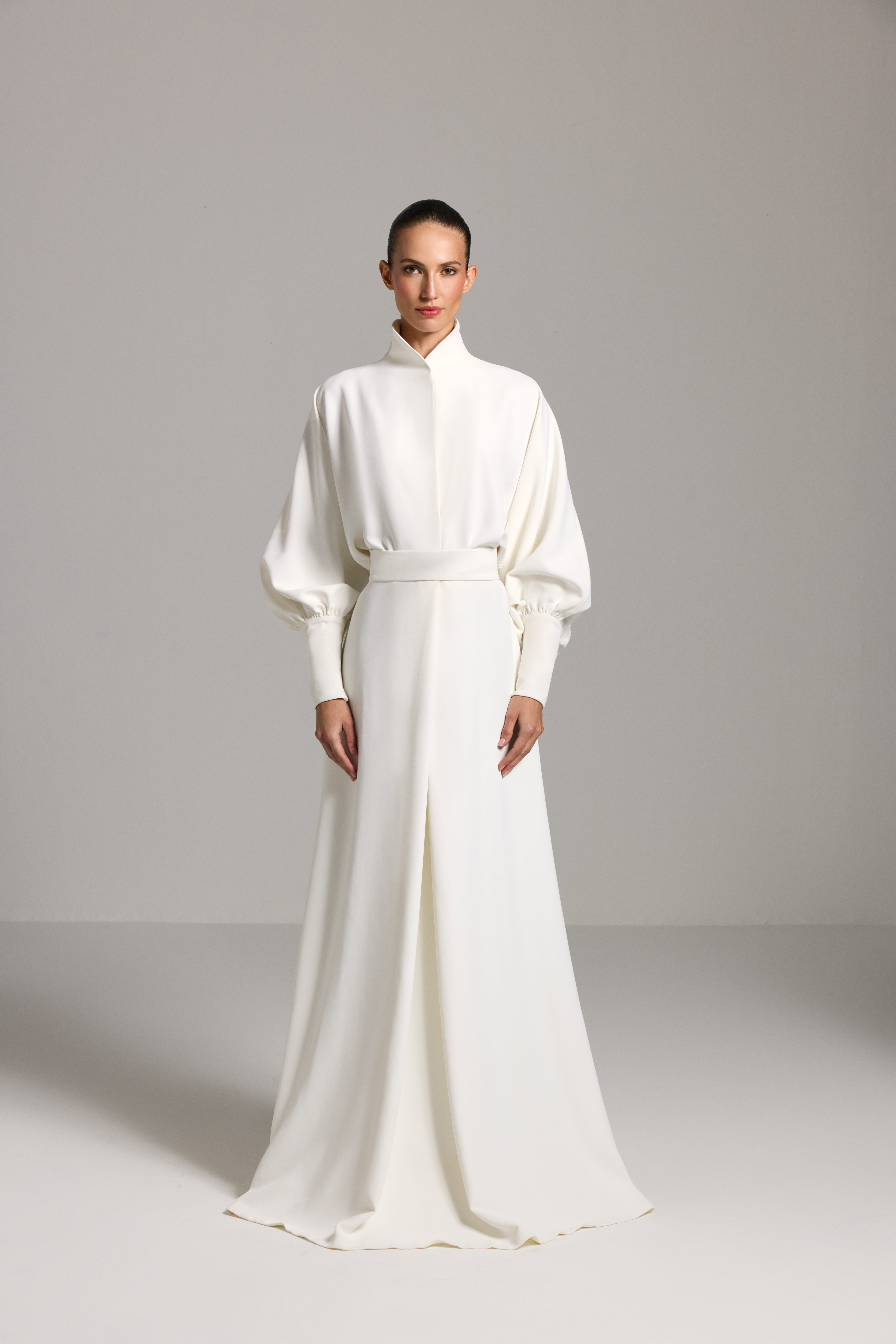 White dress AES2026P0025- A maxi-length dress with long sleeves and a defined waist - ADAMARIS - the international brand 