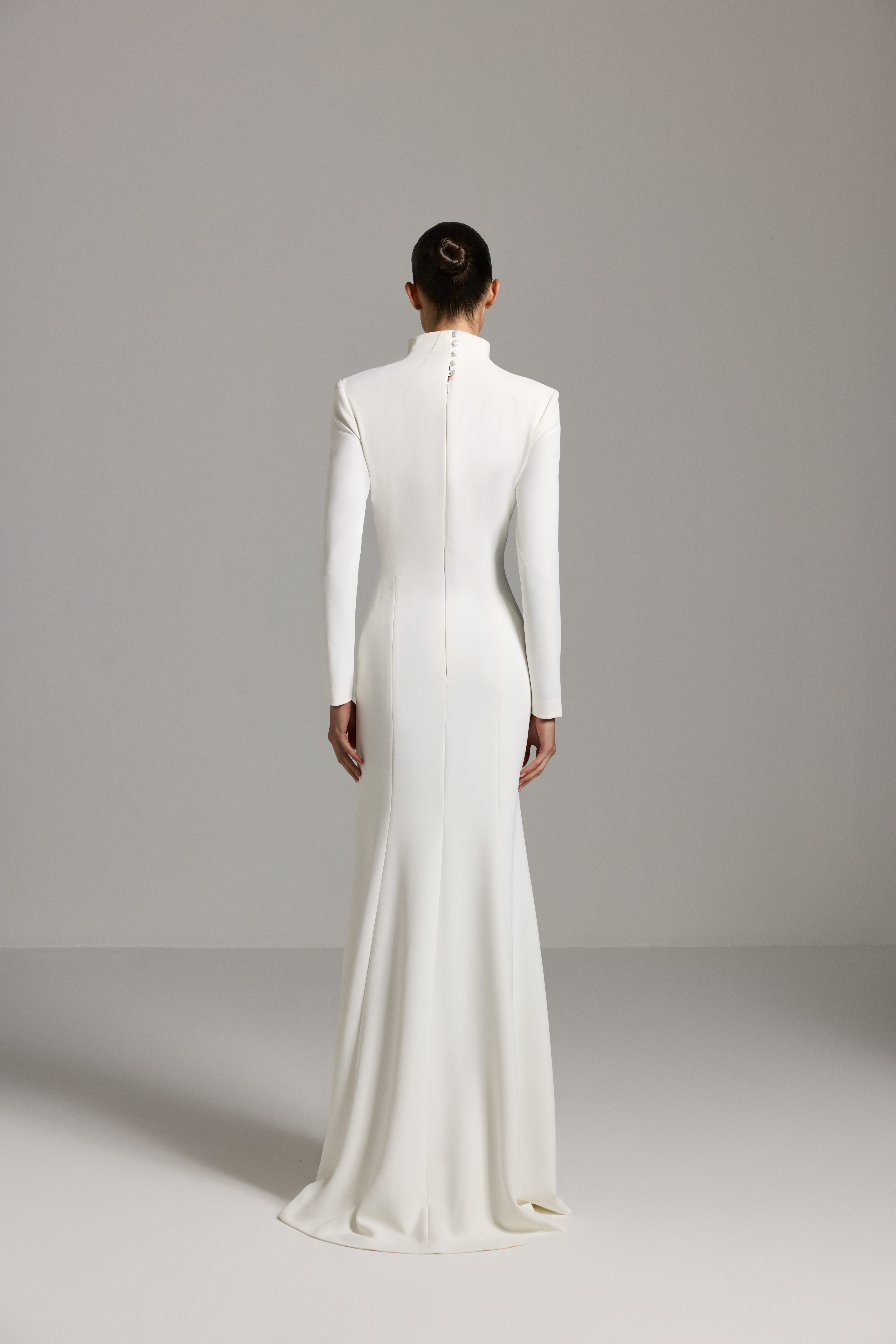 White dress AES2026P0024- A maxi-length dress with long sleeves and a deep neckline - ADAMARIS - the international brand 