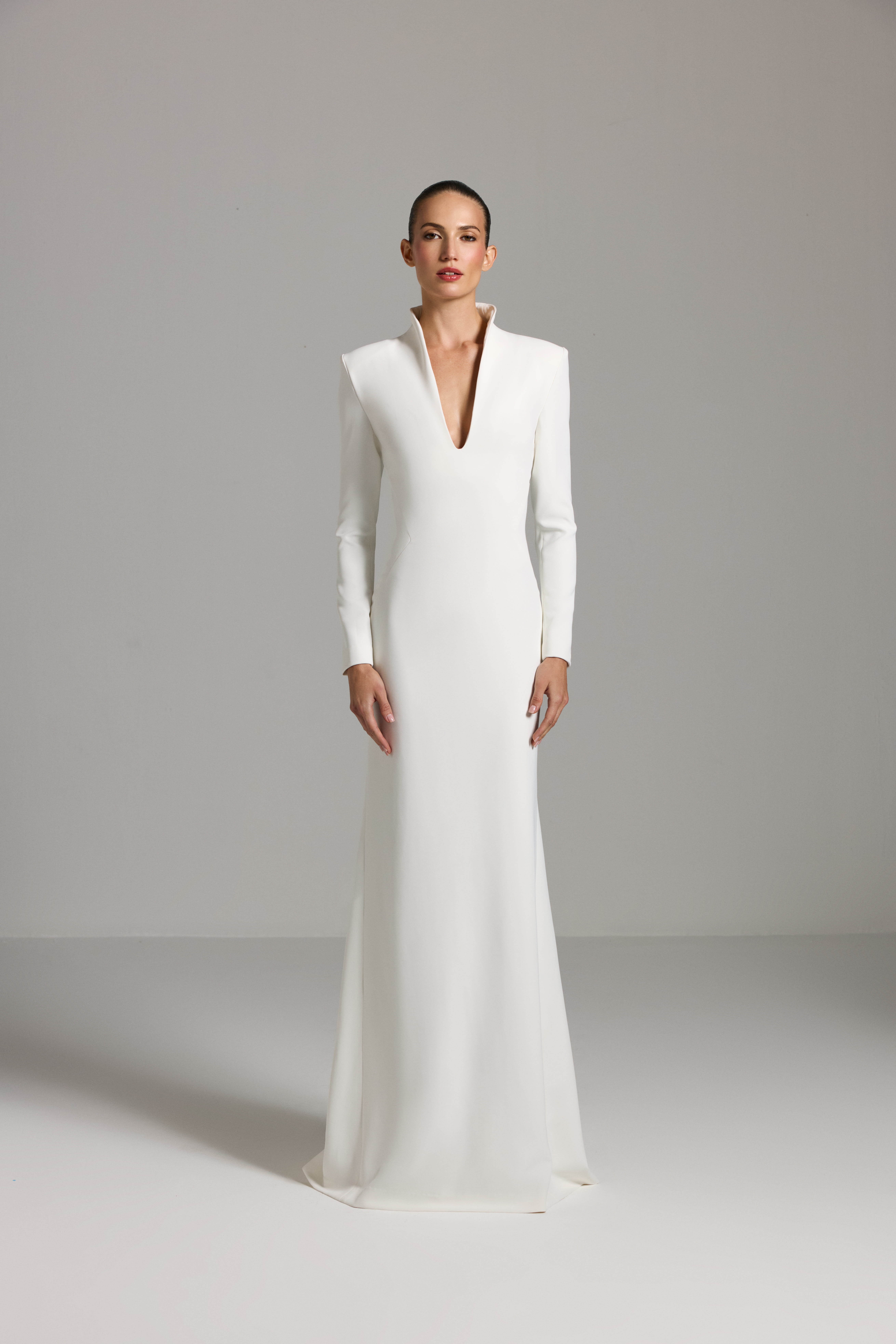 White dress AES2026P0024- A maxi-length dress with long sleeves and a deep neckline - ADAMARIS - the international brand 