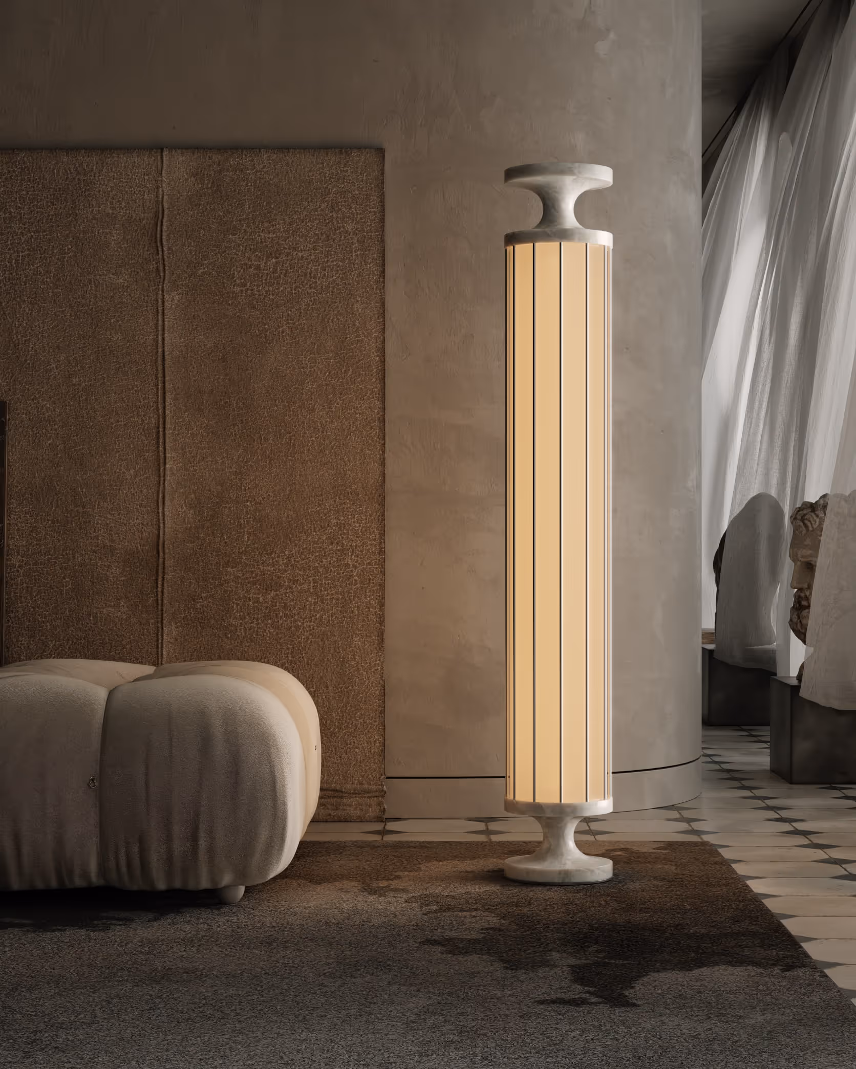 A modern living area featuring a tall, elegant lamp with vertical lines and a rounded base. The lamp is made of light-colored material, emitting a warm glow. Nearby, a plush, beige sofa with a rounded shape adds comfort to the space. The wall behind has a textured design, and natural light enters through large curtains, enhancing the inviting ambiance.