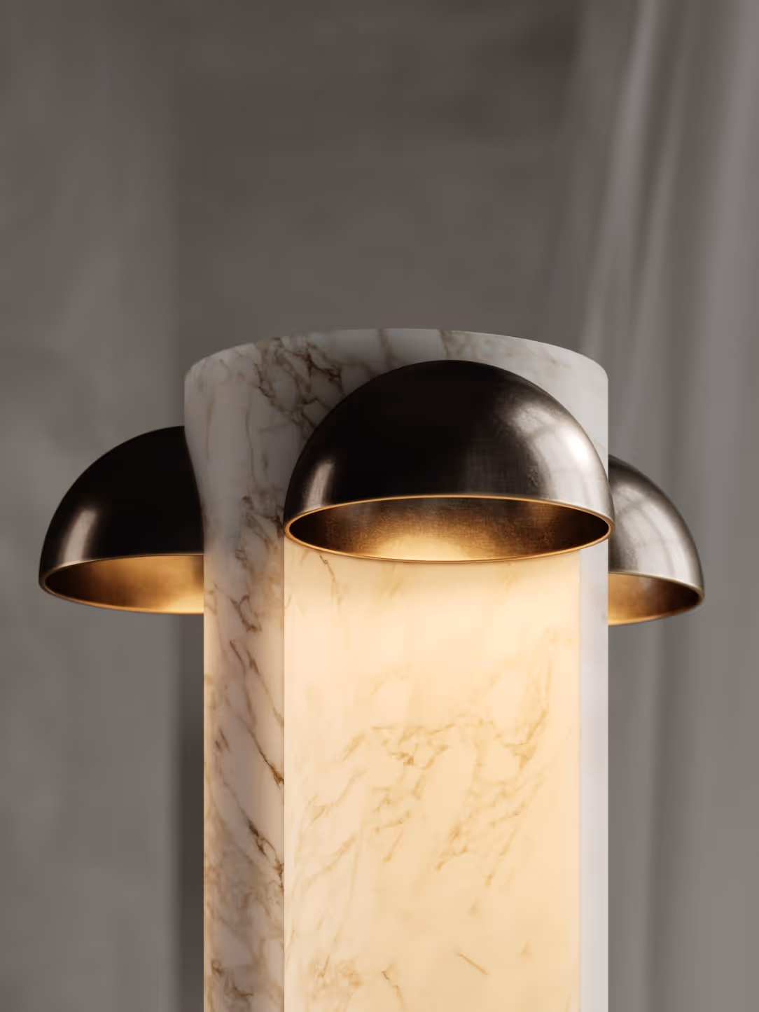 lose-up view of the lamp highlighting its elegant marble-like design and metallic dome-shaped lights, which emit a warm glow.