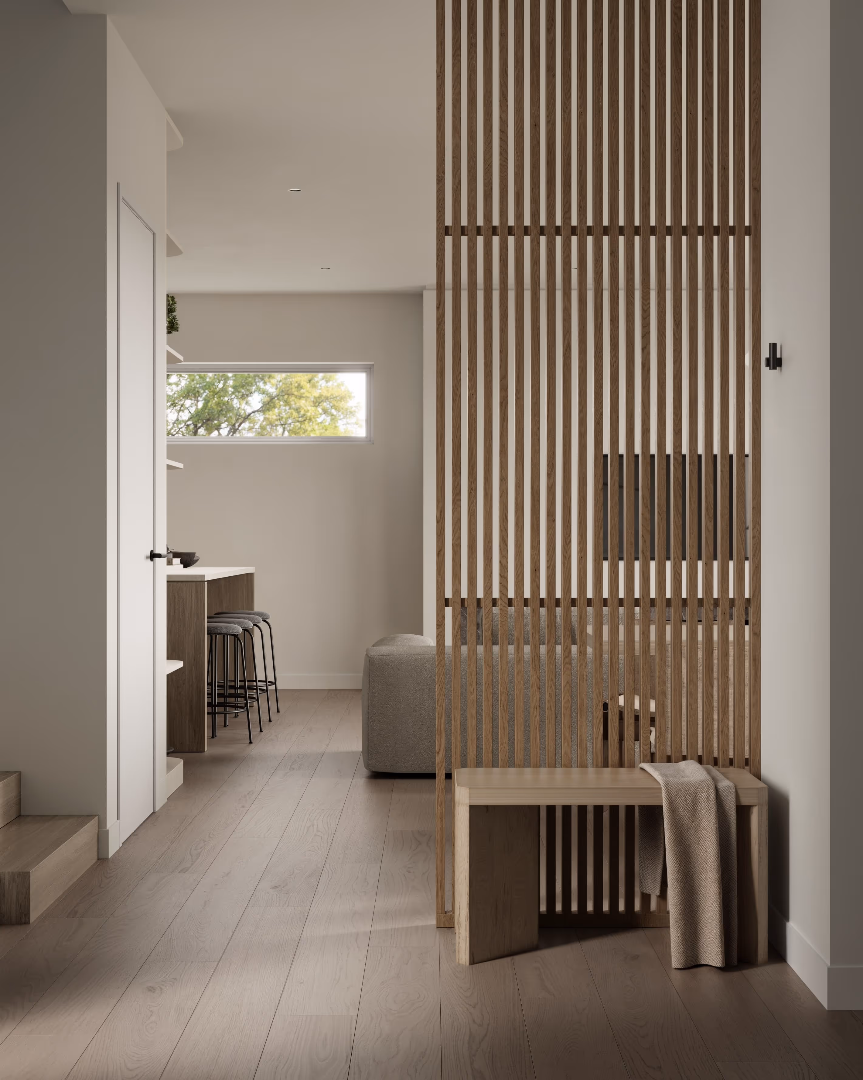 Modern home entrance with slatted wooden partition, light wood flooring, and minimalist decor.