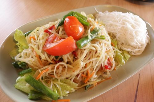 there is a plate of food with noodles and vegetables on it