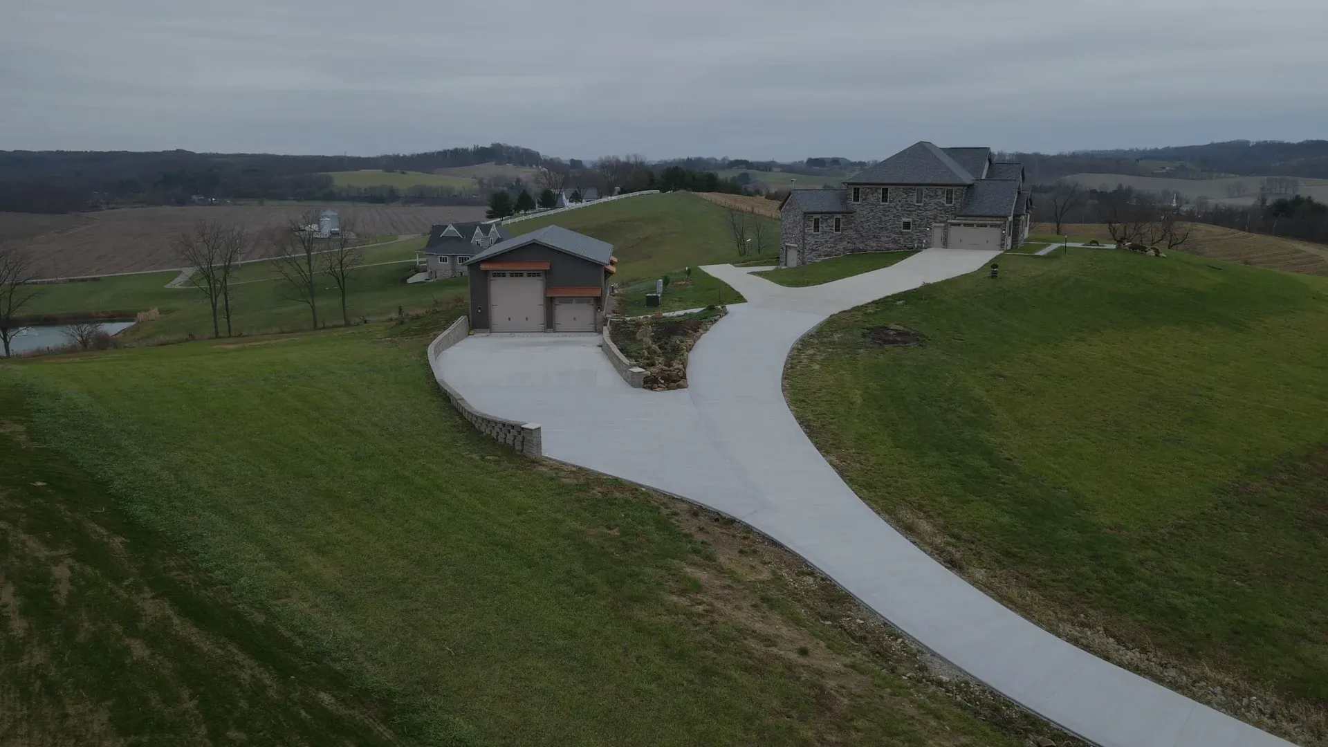 long driveway to home and garage