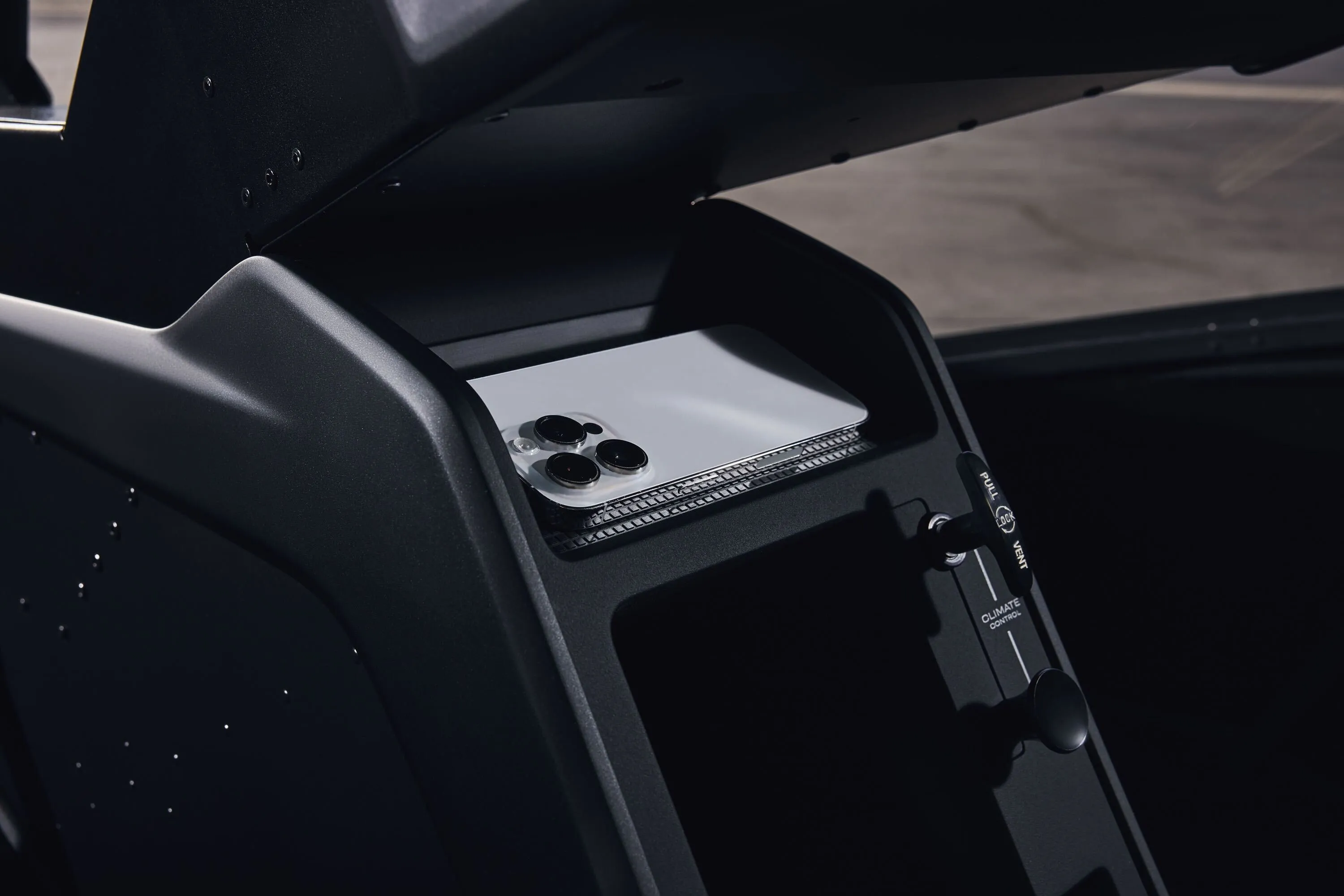 Skyryse One Interior showing an iPhone in a storage position