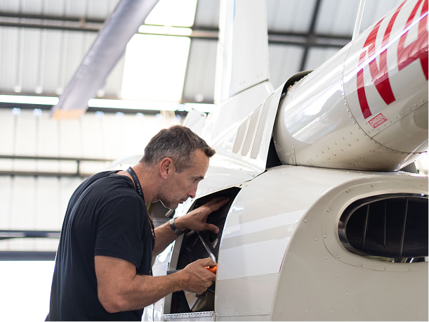 A man working on a helicopter