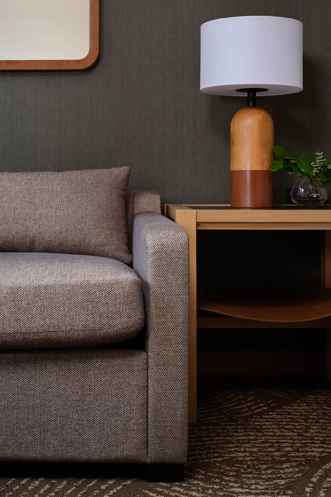 Detail view of custom guest room furnishings and lighting