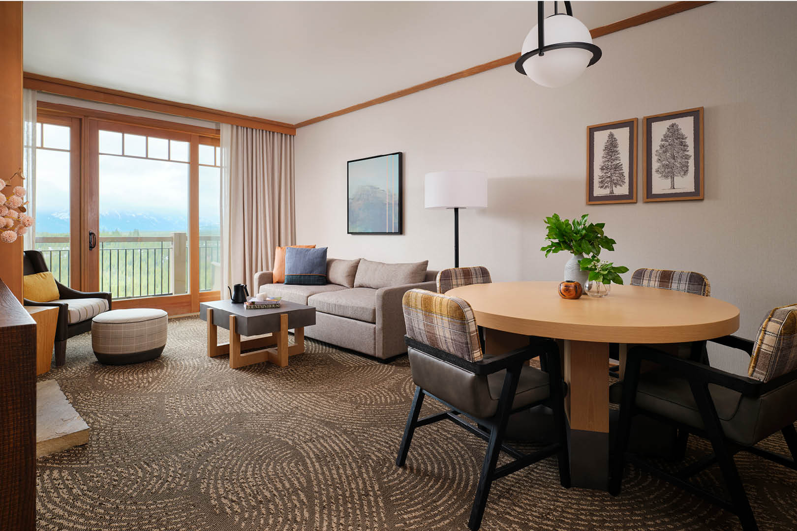 A four-seat in-room dining table and casual seating area.