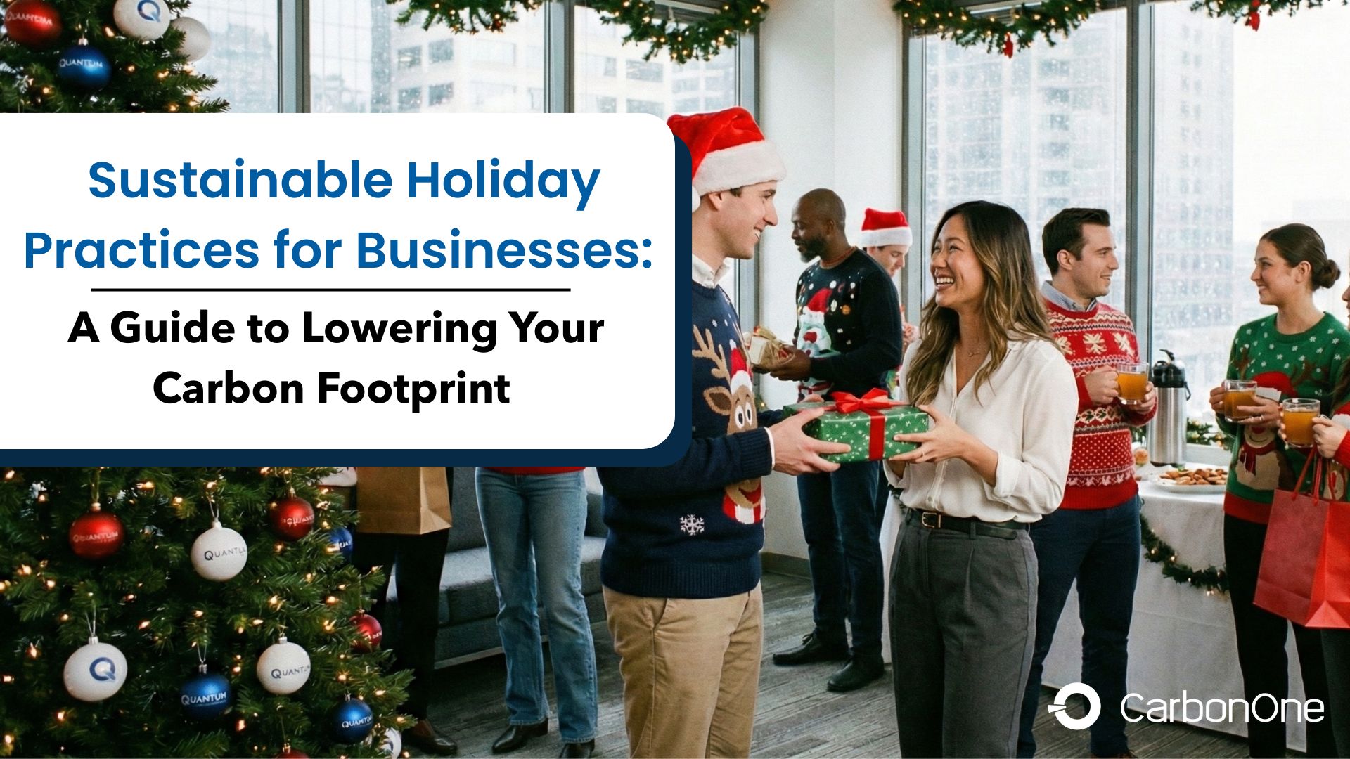 A group of coworkers celebrate at an office holiday party. A man in a Santa hat exchanges a gift with a smiling colleague beside a decorated Christmas tree.