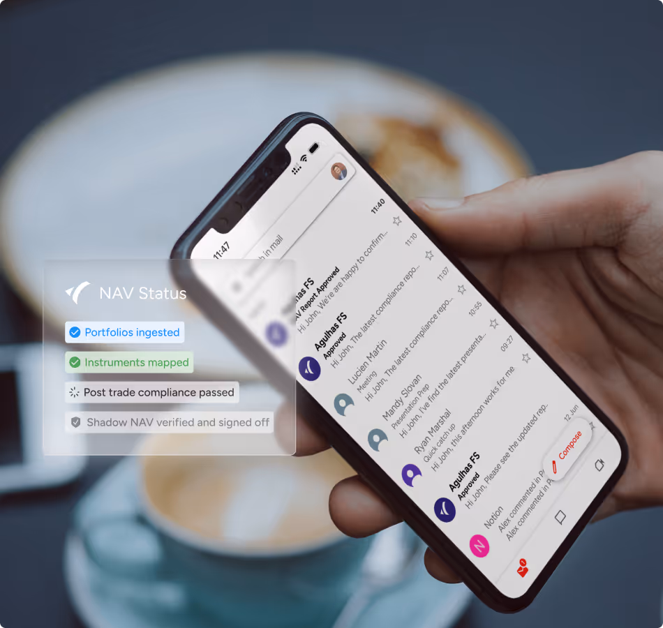 Hand holding a smartphone showing an email inbox with NAV status badges—portfolios ingested and instruments mapped—reflecting Agulhas FS’s real-time oversight tools.