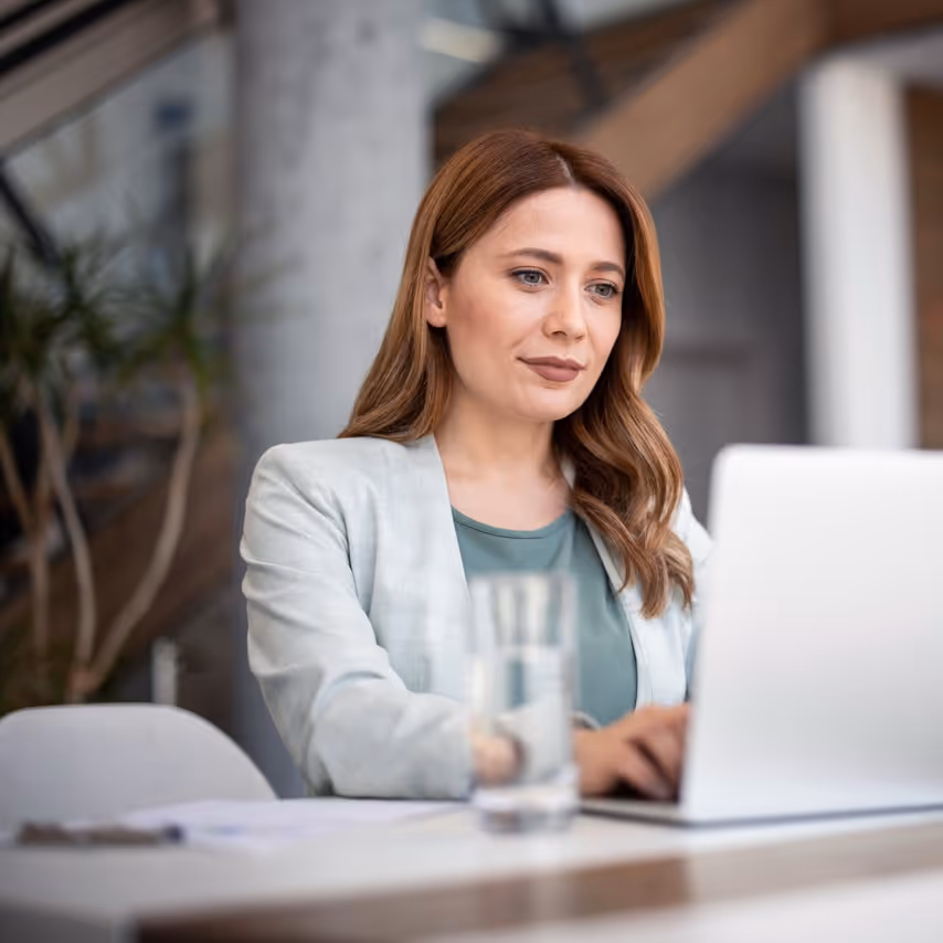 woman sitting at a laptop