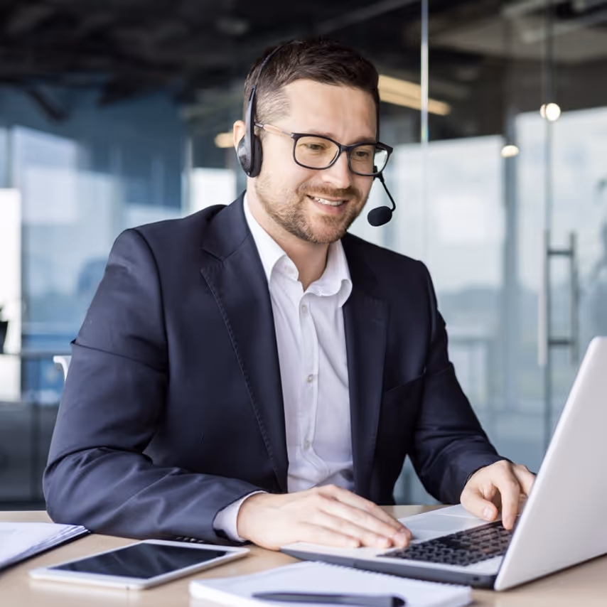 man sitting at a laptop