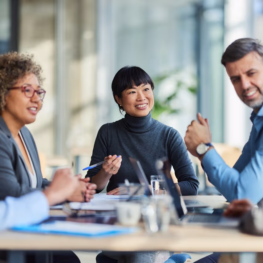 people sitting around a meeting table