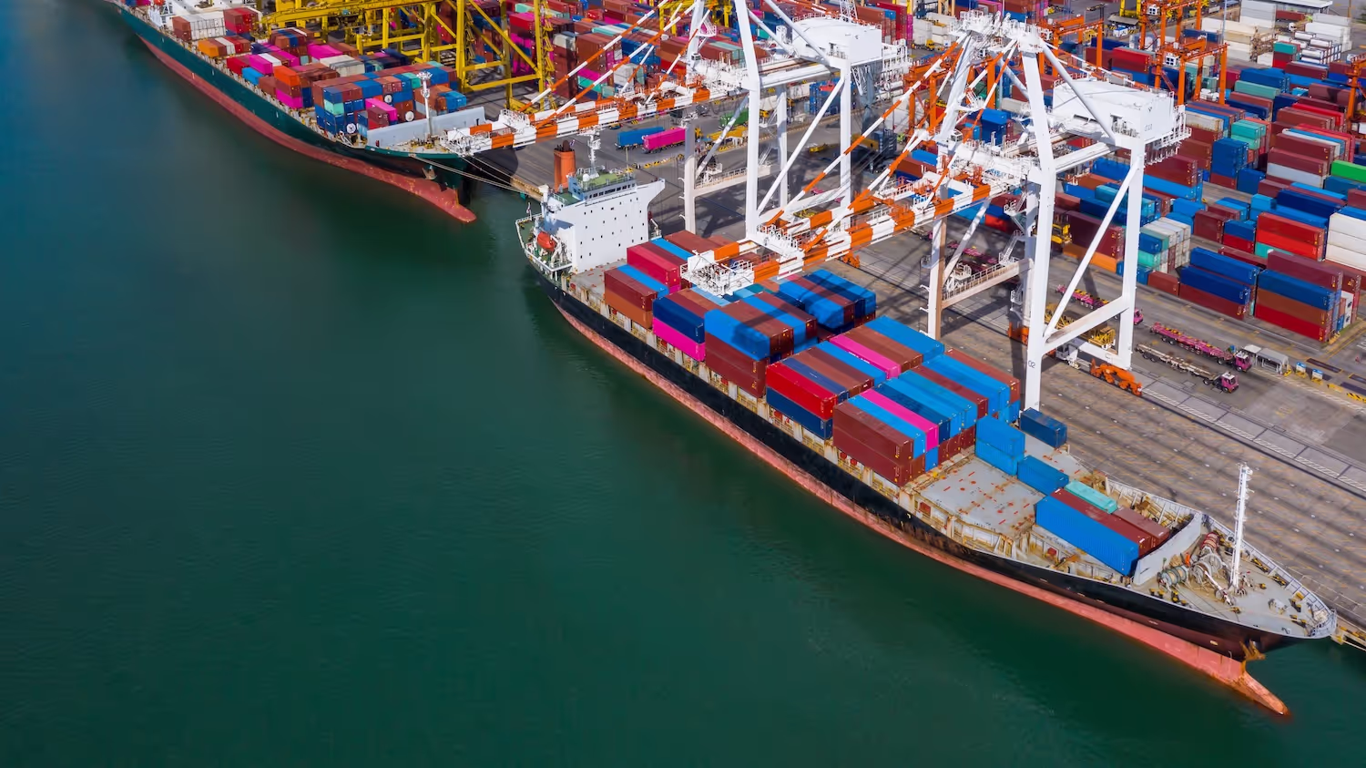 Seaport with cargo ships, representing the import terminals and storage infrastructure that underpin fuel security