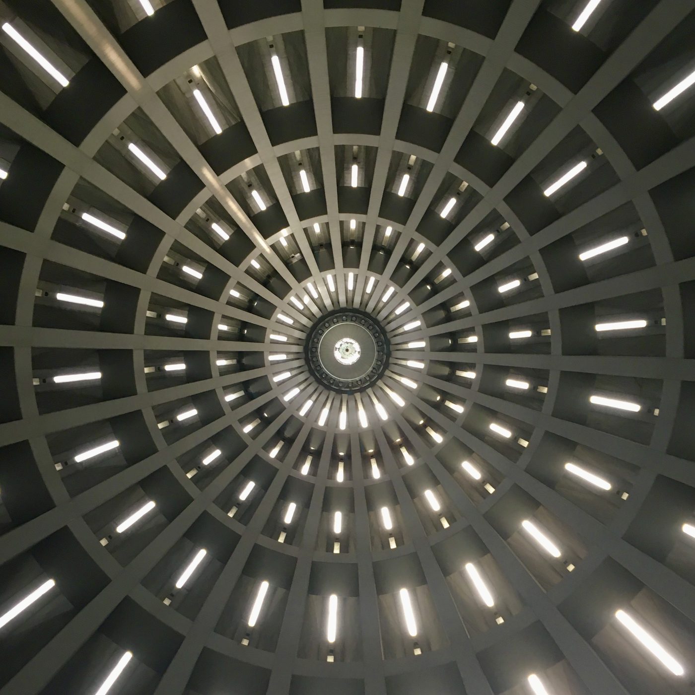 Dark spiral ceiling structure with radial lighting