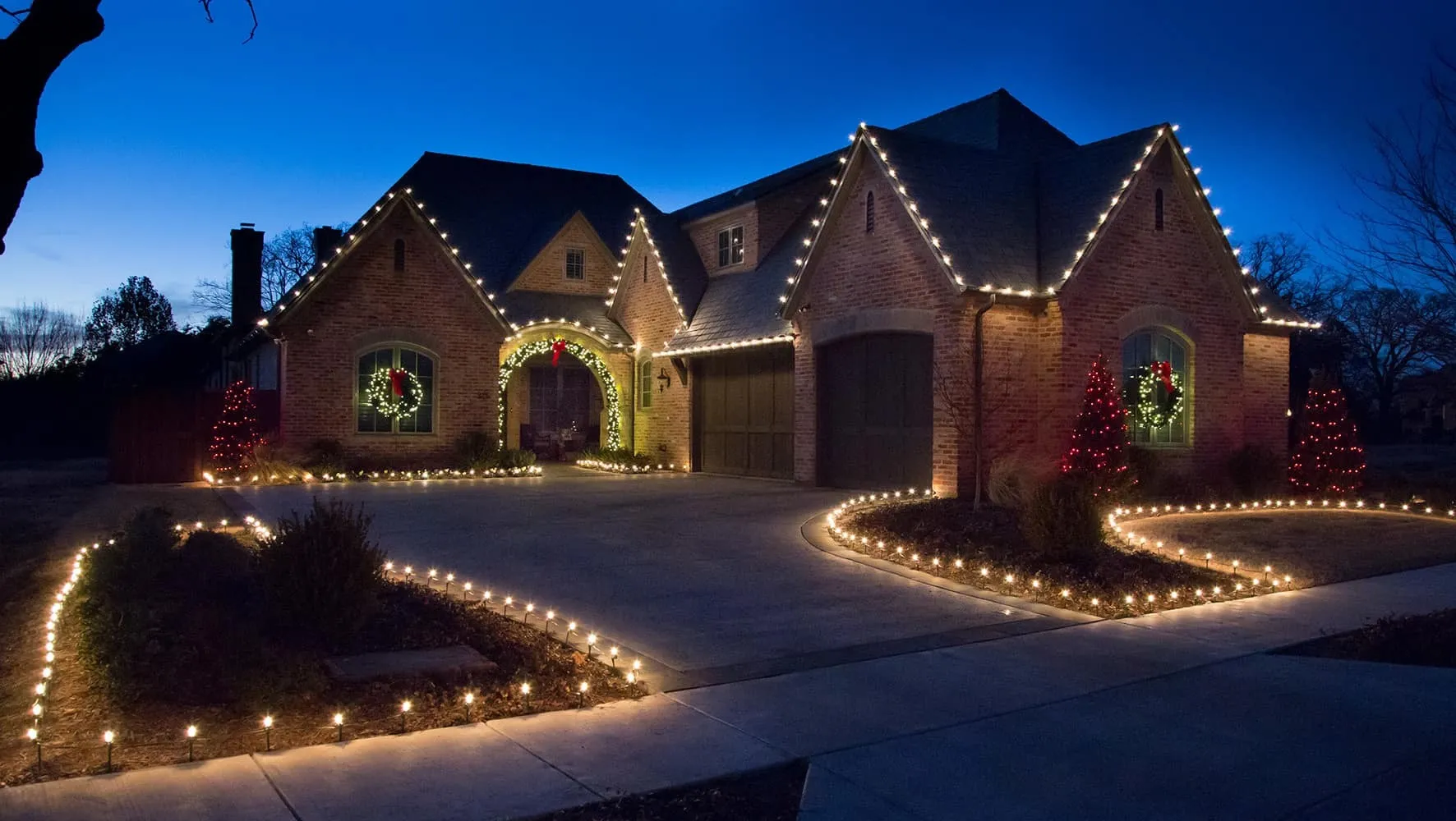 a picture of a house with christmas lights